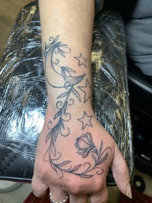 Free hand moon and vine design 